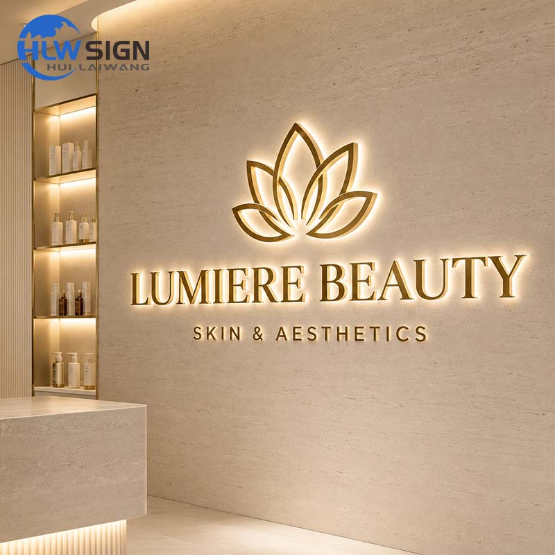 Gold halo lit letters with a soft glow on a spa wall