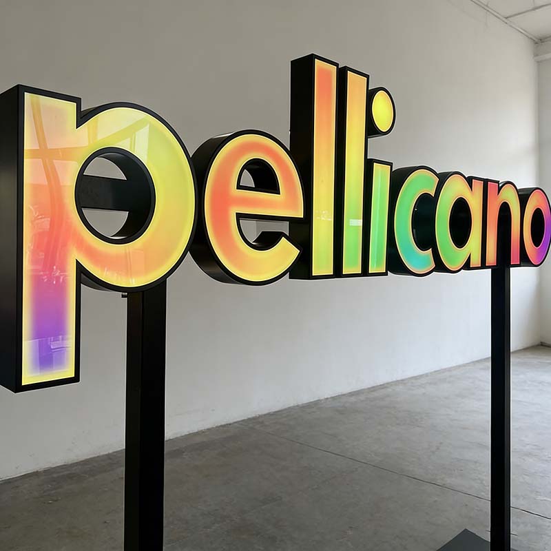 Large freestanding commercial signage at a building entrance